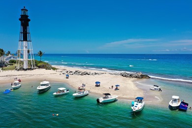 ABSOLUTELY STUNNING WATERFRONT CONDO | BREATHTAKING GOLF COURSE on Palm-Aire Country Club and Resort - The Oaks in Florida - for sale on GolfHomes.com, golf home, golf lot