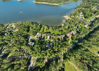 Nestled at 185 Ashley Dr, Brookeland, TX, this stunning Lake Sam on Rayburn Country Club in Texas - for sale on GolfHomes.com, golf home, golf lot