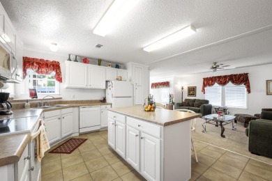 You might just fall in love when you drive up and see how lovely on Maple Leaf Golf and Country Club in Florida - for sale on GolfHomes.com, golf home, golf lot