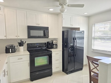 STEP INTO THE SIMPLE ELEGANCE OF THIS GROUND FLOOR CORNER IN on Wynmoor Golf Course in Florida - for sale on GolfHomes.com, golf home, golf lot