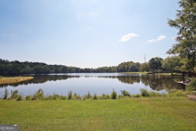 Lakefront living on Lake Peachtree! This stunning corner unit in on Canongate At Flat Creek Club in Georgia - for sale on GolfHomes.com, golf home, golf lot