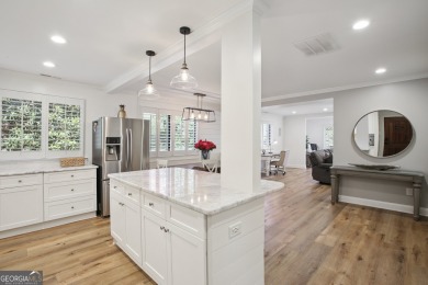Lakefront living on Lake Peachtree! This stunning corner unit in on Canongate At Flat Creek Club in Georgia - for sale on GolfHomes.com, golf home, golf lot