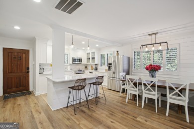 Lakefront living on Lake Peachtree! This stunning corner unit in on Canongate At Flat Creek Club in Georgia - for sale on GolfHomes.com, golf home, golf lot