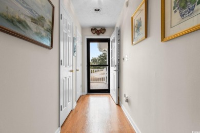Welcome to this charming 4-bedroom, 3-bathroom fully furnished on Surf Golf and Beach Club in South Carolina - for sale on GolfHomes.com, golf home, golf lot