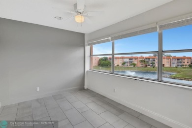 BEAUTIFUL, SPACIOUS 2 BEDROOM, 2 BATH ON THE TOP FLOOR WITH on Sunrise Lakes Phase III in Florida - for sale on GolfHomes.com, golf home, golf lot