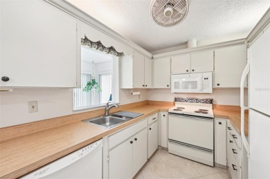 Enjoy effortless Florida living in this fully furnished on Falcon Watch Golf Club in Florida - for sale on GolfHomes.com, golf home, golf lot