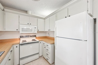 Enjoy effortless Florida living in this fully furnished on Falcon Watch Golf Club in Florida - for sale on GolfHomes.com, golf home, golf lot