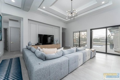 Stunning modern home built in 2022, located in the SPI golf on South Padre Island Golf Club in Texas - for sale on GolfHomes.com, golf home, golf lot