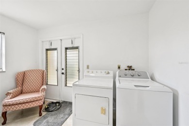 Enjoy effortless Florida living in this fully furnished on Falcon Watch Golf Club in Florida - for sale on GolfHomes.com, golf home, golf lot