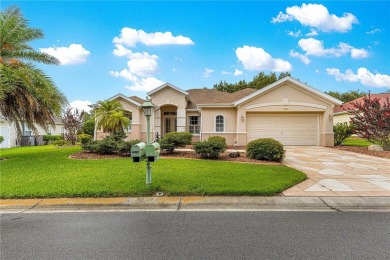 Golf Course location with panoramic views to a tree lined area on Eagle Ridge At Spruce Creek Country Club in Florida - for sale on GolfHomes.com, golf home, golf lot