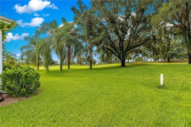 Golf Course location with panoramic views to a tree lined area on Eagle Ridge At Spruce Creek Country Club in Florida - for sale on GolfHomes.com, golf home, golf lot