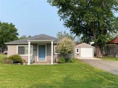 Fall in love with lake living! Just a short walk to Lake Erie on Lake Erie Metropark Golf Course in Michigan - for sale on GolfHomes.com, golf home, golf lot