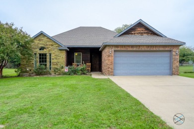 Custom built home!  The combination of brick,stone,and cedar on Star Harbor Golf Club in Texas - for sale on GolfHomes.com, golf home, golf lot
