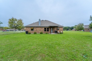 Custom built home!  The combination of brick,stone,and cedar on Star Harbor Golf Club in Texas - for sale on GolfHomes.com, golf home, golf lot
