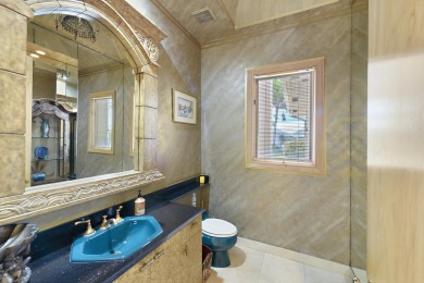 Incredible one story, 4 bedroom, 4.1 bathroom estate located on on St. Andrews Country Club of Boca Raton in Florida - for sale on GolfHomes.com, golf home, golf lot