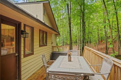 Perched above the shoreline on nearly half an acre, this turnkey on The Highlands Course at Lake Arrowhead in Georgia - for sale on GolfHomes.com, golf home, golf lot