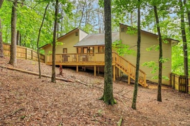 Perched above the shoreline on nearly half an acre, this turnkey on The Highlands Course at Lake Arrowhead in Georgia - for sale on GolfHomes.com, golf home, golf lot