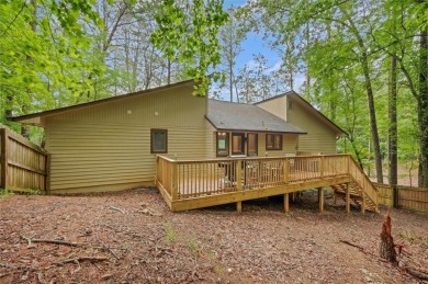 Perched above the shoreline on nearly half an acre, this turnkey on The Highlands Course at Lake Arrowhead in Georgia - for sale on GolfHomes.com, golf home, golf lot