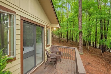 Perched above the shoreline on nearly half an acre, this turnkey on The Highlands Course at Lake Arrowhead in Georgia - for sale on GolfHomes.com, golf home, golf lot