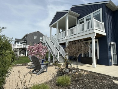 Luxury living at Macatawa Legends! Stunning home overlooking the on The Macatwa Legends Golf Course in Michigan - for sale on GolfHomes.com, golf home, golf lot