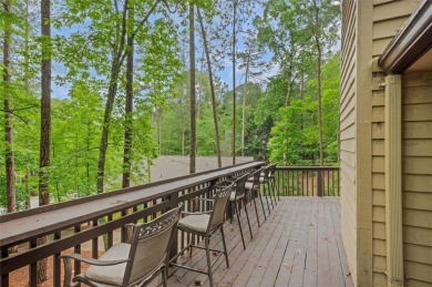 Perched above the shoreline on nearly half an acre, this turnkey on The Highlands Course at Lake Arrowhead in Georgia - for sale on GolfHomes.com, golf home, golf lot