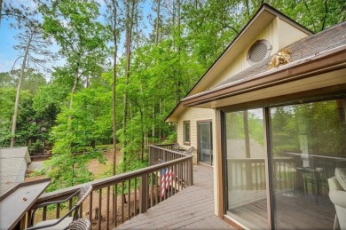 Perched above the shoreline on nearly half an acre, this turnkey on The Highlands Course at Lake Arrowhead in Georgia - for sale on GolfHomes.com, golf home, golf lot