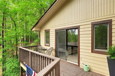 Perched above the shoreline on nearly half an acre, this turnkey on The Highlands Course at Lake Arrowhead in Georgia - for sale on GolfHomes.com, golf home, golf lot