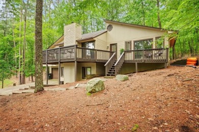 Perched above the shoreline on nearly half an acre, this turnkey on The Highlands Course at Lake Arrowhead in Georgia - for sale on GolfHomes.com, golf home, golf lot