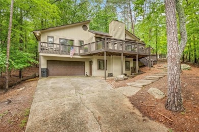 Perched above the shoreline on nearly half an acre, this turnkey on The Highlands Course at Lake Arrowhead in Georgia - for sale on GolfHomes.com, golf home, golf lot