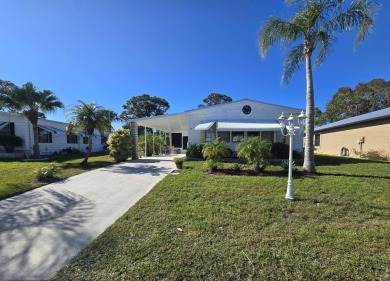 Discover this fully furnished home on the 8th Green, offering on Spanish Lakes Country Club in Florida - for sale on GolfHomes.com, golf home, golf lot