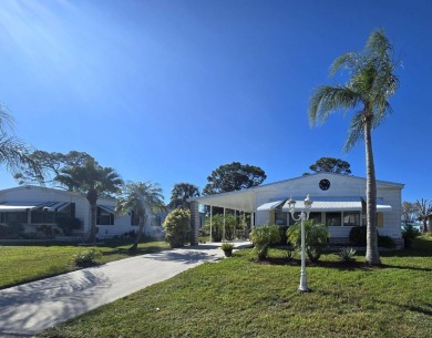 Discover this fully furnished home on the 8th Green, offering on Spanish Lakes Country Club in Florida - for sale on GolfHomes.com, golf home, golf lot