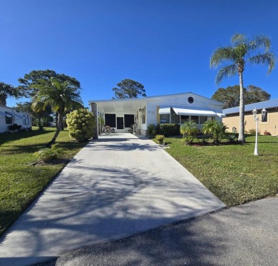 Discover this fully furnished home on the 8th Green, offering on Spanish Lakes Country Club in Florida - for sale on GolfHomes.com, golf home, golf lot