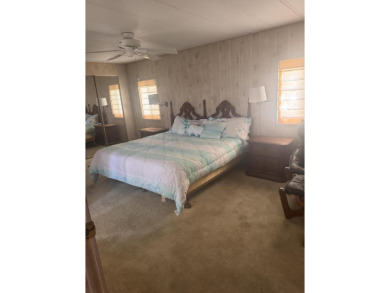 Live the Florida lifestyle in this beautifully maintained 2-bed on Spanish Lakes Golf Village in Florida - for sale on GolfHomes.com, golf home, golf lot