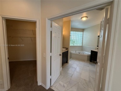 Gorgeous single-story Mediterranean-style pool home in the gated on TPC Eagle Trace in Florida - for sale on GolfHomes.com, golf home, golf lot