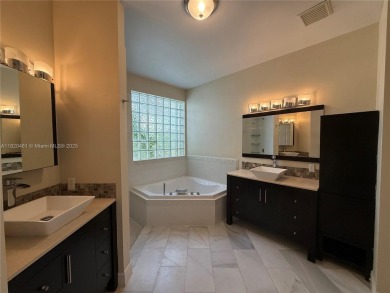 Gorgeous single-story Mediterranean-style pool home in the gated on TPC Eagle Trace in Florida - for sale on GolfHomes.com, golf home, golf lot