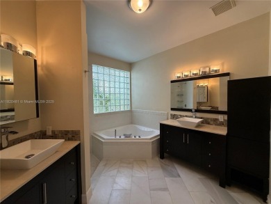 Gorgeous single-story Mediterranean-style pool home in the gated on TPC Eagle Trace in Florida - for sale on GolfHomes.com, golf home, golf lot