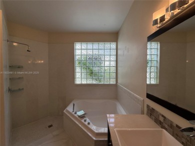 Gorgeous single-story Mediterranean-style pool home in the gated on TPC Eagle Trace in Florida - for sale on GolfHomes.com, golf home, golf lot