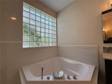 Gorgeous single-story Mediterranean-style pool home in the gated on TPC Eagle Trace in Florida - for sale on GolfHomes.com, golf home, golf lot