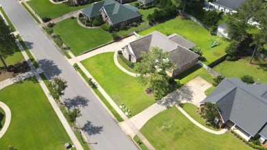 Nestled within the prestigious Robert Trent Jones Golf Course on Highland Oaks Golf Course in Alabama - for sale on GolfHomes.com, golf home, golf lot