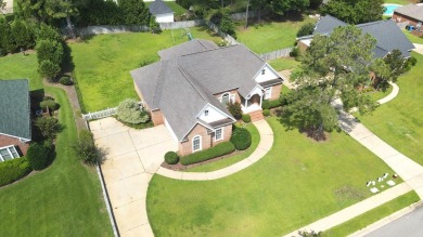 Nestled within the prestigious Robert Trent Jones Golf Course on Highland Oaks Golf Course in Alabama - for sale on GolfHomes.com, golf home, golf lot