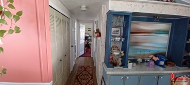 Come settle down and relax in a beautiful manufactured home with on Fairways Country Club in Florida - for sale on GolfHomes.com, golf home, golf lot