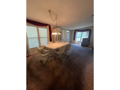 Take a look at this charming and spacious partially furnished on Lake Henry Golf Club in Florida - for sale on GolfHomes.com, golf home, golf lot