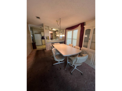 Take a look at this charming and spacious partially furnished on Lake Henry Golf Club in Florida - for sale on GolfHomes.com, golf home, golf lot