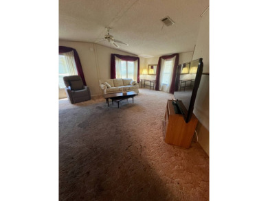 Take a look at this charming and spacious partially furnished on Lake Henry Golf Club in Florida - for sale on GolfHomes.com, golf home, golf lot