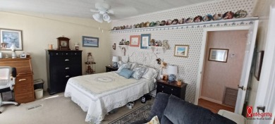 Come settle down and relax in a beautiful manufactured home with on Fairways Country Club in Florida - for sale on GolfHomes.com, golf home, golf lot