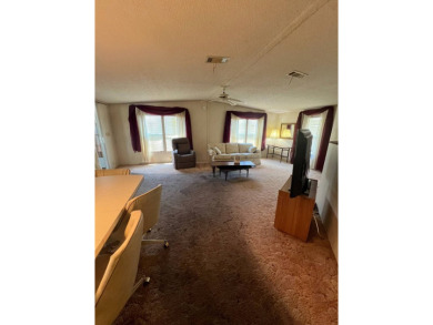 Take a look at this charming and spacious partially furnished on Lake Henry Golf Club in Florida - for sale on GolfHomes.com, golf home, golf lot