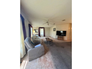 Take a look at this charming and spacious partially furnished on Lake Henry Golf Club in Florida - for sale on GolfHomes.com, golf home, golf lot