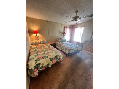 Take a look at this charming and spacious partially furnished on Lake Henry Golf Club in Florida - for sale on GolfHomes.com, golf home, golf lot