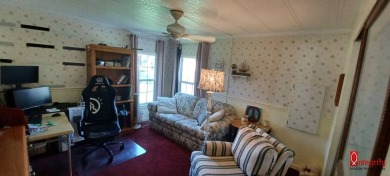 Come settle down and relax in a beautiful manufactured home with on Fairways Country Club in Florida - for sale on GolfHomes.com, golf home, golf lot