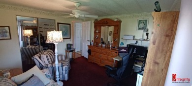 Come settle down and relax in a beautiful manufactured home with on Fairways Country Club in Florida - for sale on GolfHomes.com, golf home, golf lot